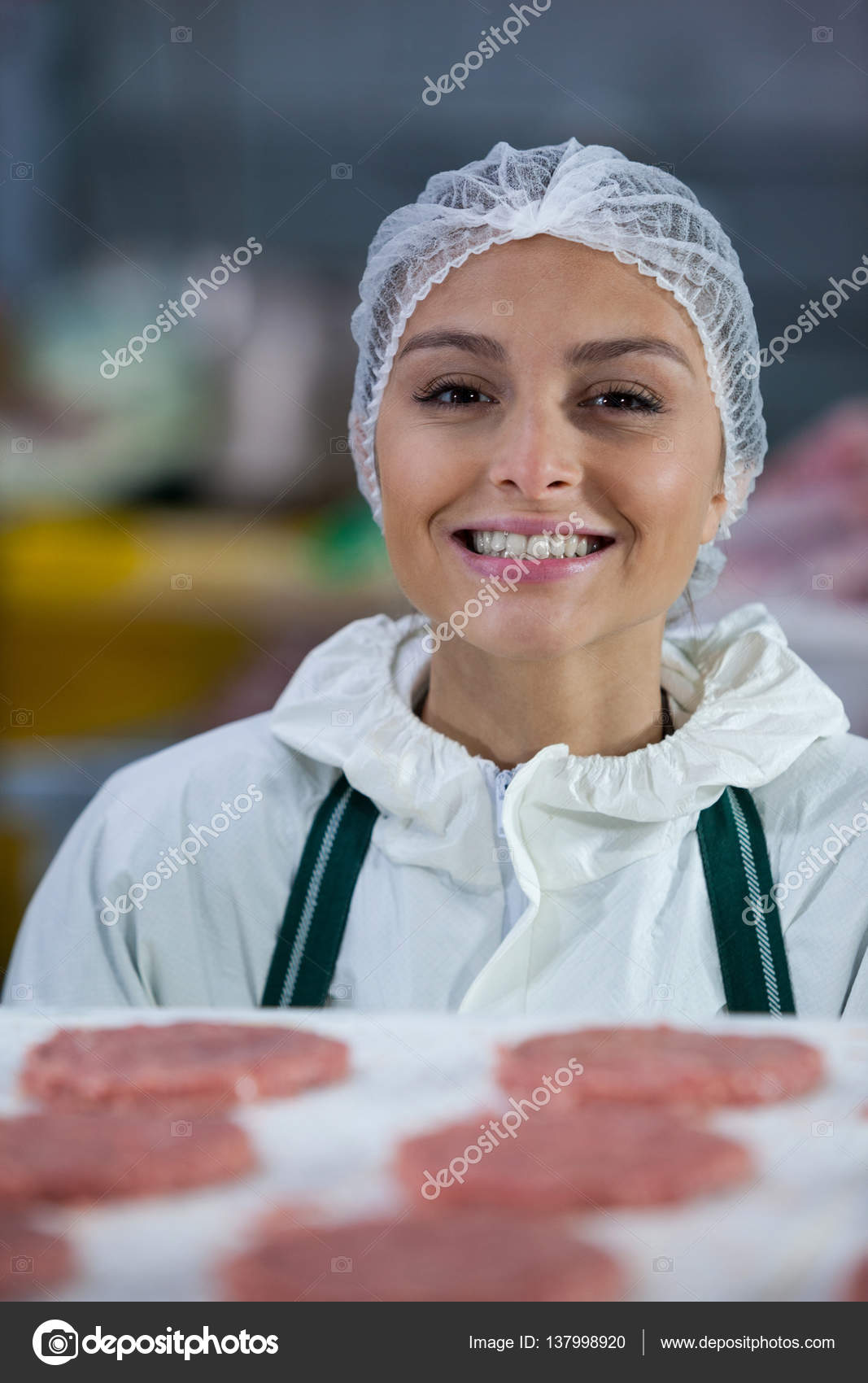 Female butcher at meat factory Stock Photo by ©Wavebreakmedia 137998920