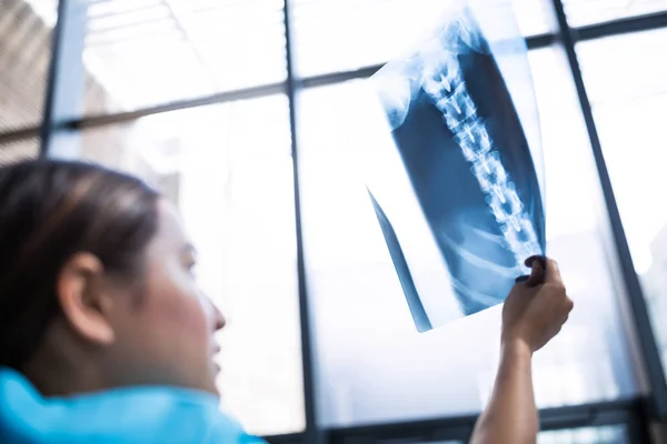 Nurse examining X-ray report — Stock Photo, Image