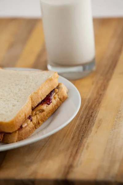 Peanut butter and jam sandwich on plate — Stock Photo, Image