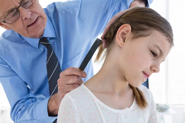 Doctor examining patient neck — Stock Photo, Image