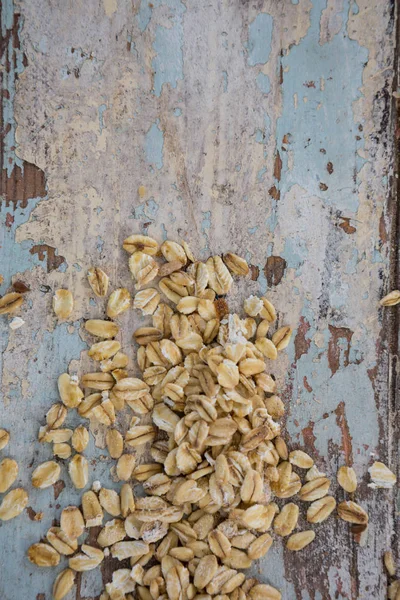 Oats on wooden surface — Stock Photo, Image