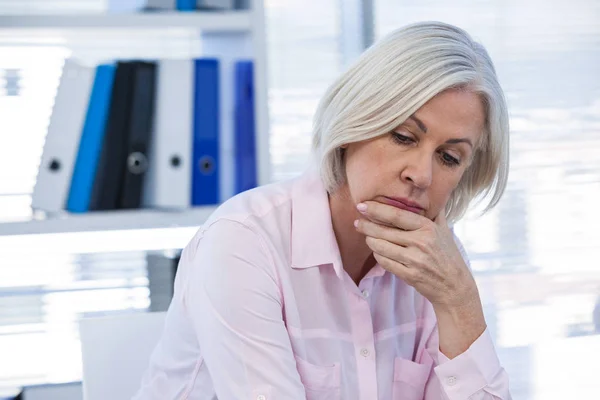 Upset patient sitting at medical clinic — Stock Photo, Image