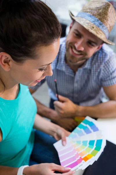 Couple interacting with each other in cafe — Stock Photo, Image