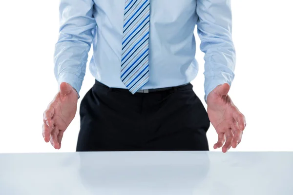 Businessman pretending to hold an invisible object — Stock Photo, Image