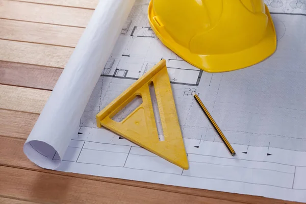 Architectural plan with tools and hard hat — Stock Photo, Image