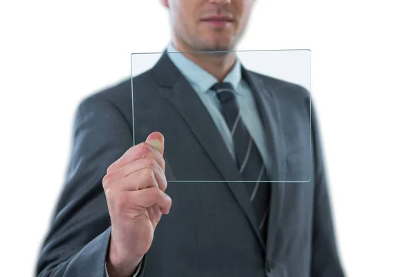 Businessman holding futuristic digital tablet — Stock Photo, Image