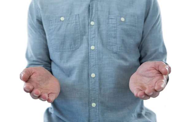 Man pretending to hold an invisible object — Stock Photo, Image