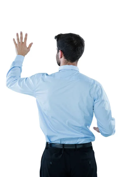 Businessman pretending to touch an invisible screen — Stock Photo, Image