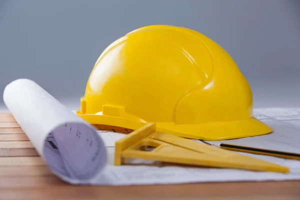 Architectural plan with tools and hard hat — Stock Photo, Image