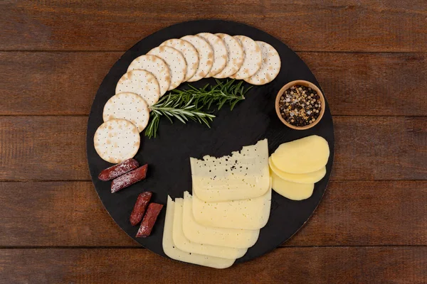 Cheese, rosemary, sausages, spices — Stock Photo, Image