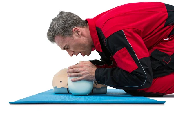 Paramedic blowing oxygen to dummy — Stock Photo, Image