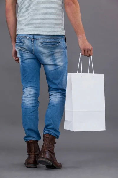 Man holding shopping bag — Stock Photo, Image