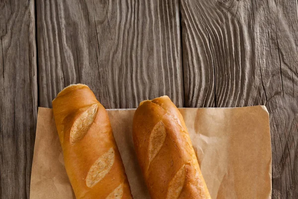 Baguettes on wooden background — Stock Photo, Image