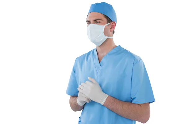 Surgeons hand wearing surgical gloves and holding — Stock Photo, Image