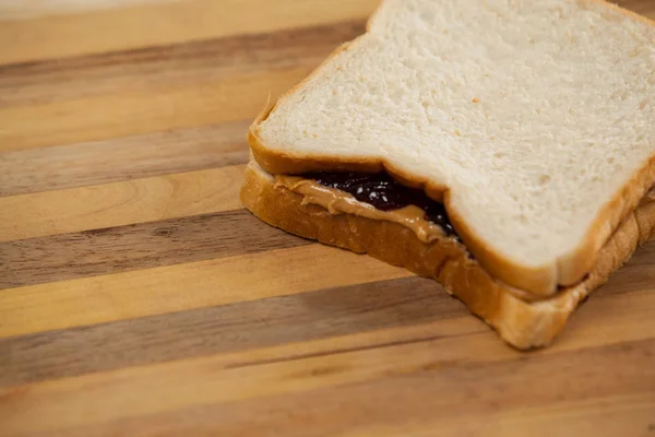 Bread sandwich with jam and peanut butter — Stock Photo, Image