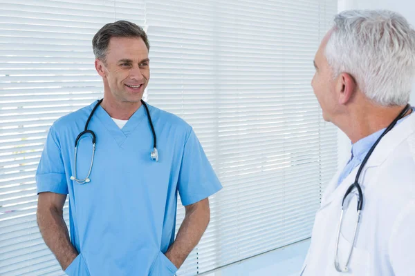 Surgeon and doctor interacting with each other — Stock Photo, Image