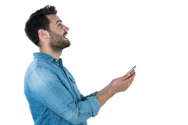 Człowiek marzy trzymając telefon komórkowy — Zdjęcie stockowe