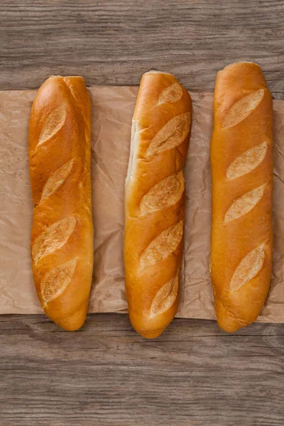 Baguettes on wooden background — Stock Photo, Image