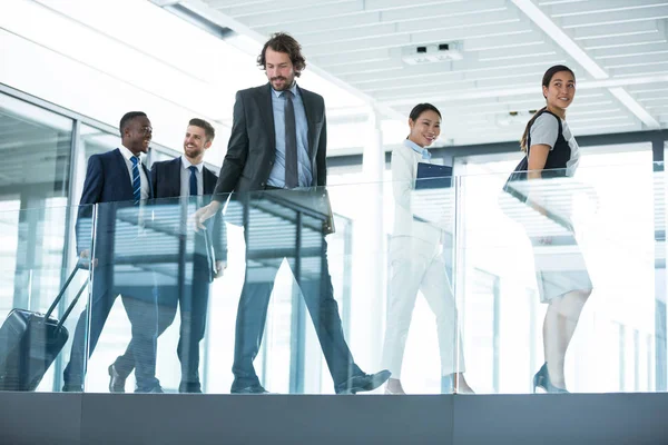Businesspeople walking in office — Stock Photo, Image