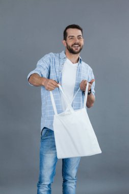 man holding an empty shopping bag clipart