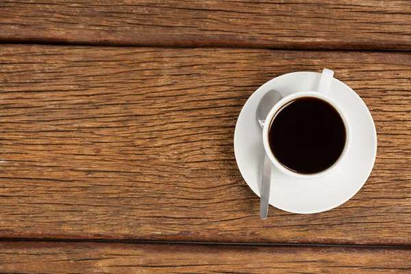 Taza de café sobre mesa de madera —  Fotos de Stock
