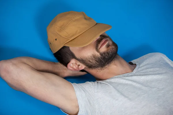 Close-up of man in cap relaxing — Stock Photo, Image