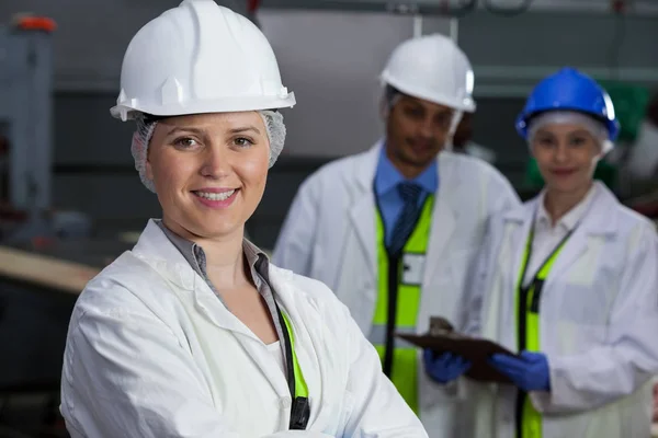 Technicians standing in meat factory — Stock Photo, Image