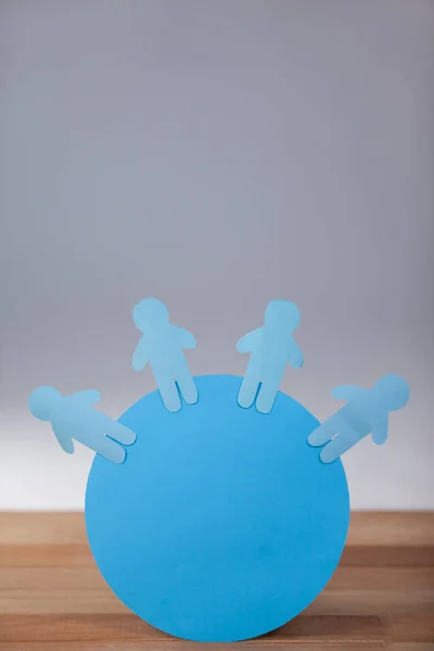 Blue and paper cut-out people — Stock Photo, Image