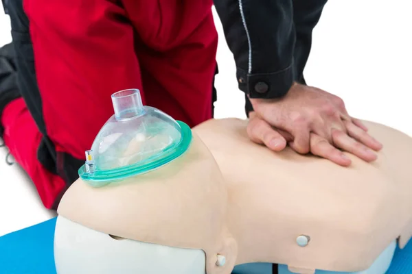 Paramedic practising resuscitation on dummy — Stock Photo, Image