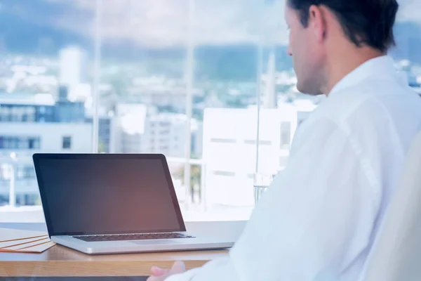 Businessman looking at a laptop — Stock Photo, Image