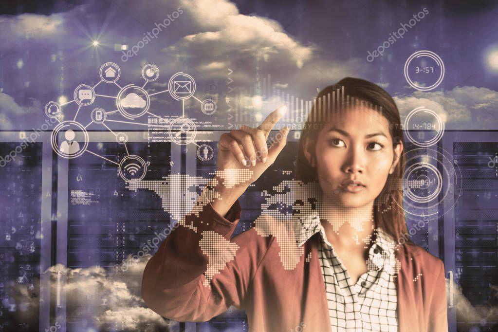 Businesswoman pointing against server room in blue