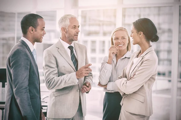 Happy business team talking — Stock Photo, Image