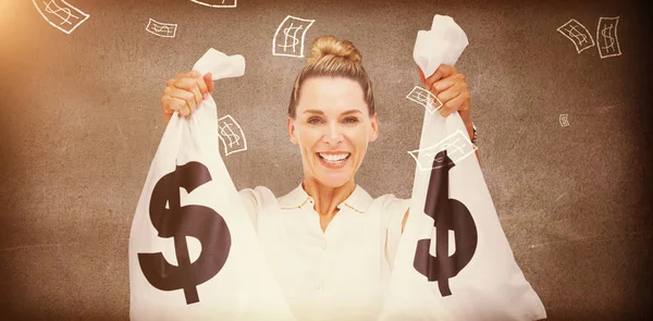 Businesswoman holding cash bags — Stock Photo, Image