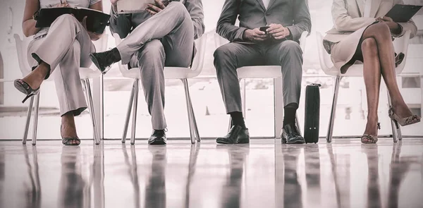 Well dressed business people waiting — Stock Photo, Image