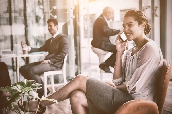 Happy businesswoman talking on phone — Stock Photo, Image