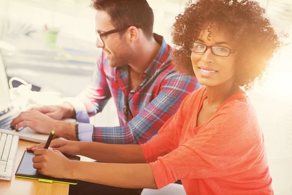 Designer using a graphics tablet in her office — Stock Photo, Image