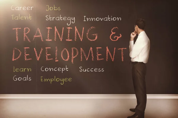 Training and development terms written on a blackboard — Stock Photo, Image