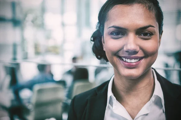 Smiling businesswoman in office — Stock Photo, Image