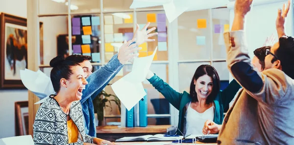 Business people throwing papers in the air — Stock Photo, Image