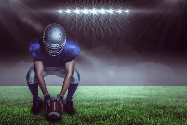 American football player in uniform holding ball — Stock Photo, Image