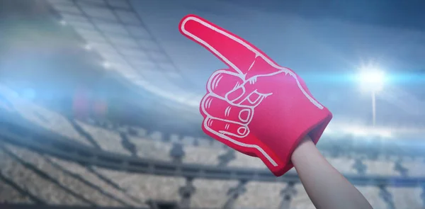 Player holding supporter foam hand — Stock Photo, Image