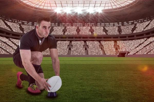 Rugby player getting ready to kick ball — Stock Photo, Image
