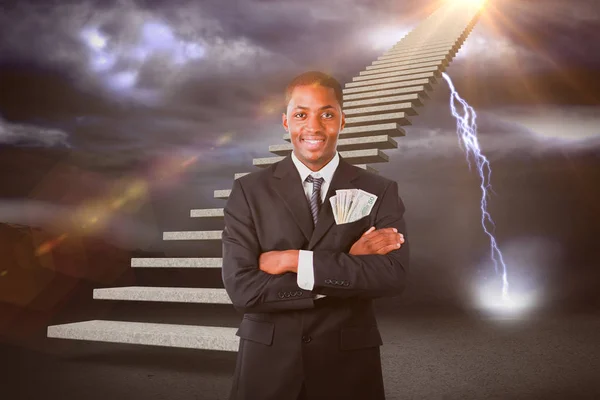 Composietbeeld van knappe zakenman met dollars in een zak 3d — Stockfoto