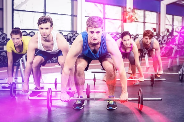 Atletische mannen en vrouwen uit te werken — Stockfoto