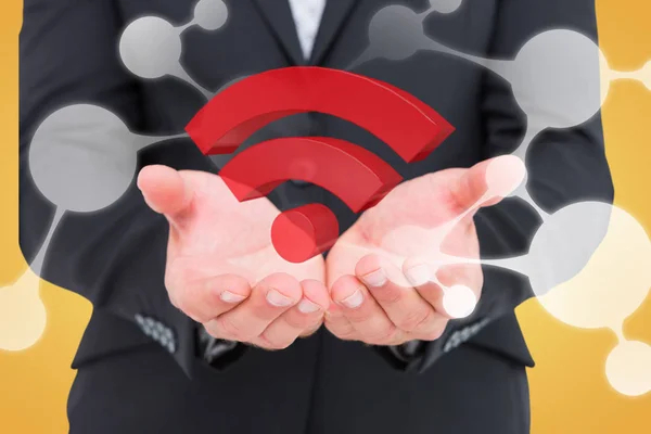 Homme d'affaires tenant le symbole wifi dans les mains — Photo