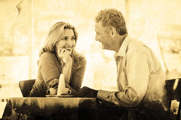 Romantic couple sitting in restaurant — Stock Photo, Image