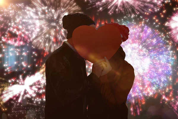 Couple holding heart shape paper — Stock Photo, Image