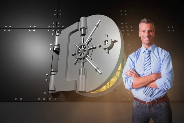 Smiling manager with arms crossed in warehouse — Stock Photo, Image