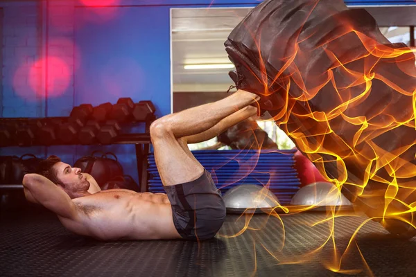 Man exercising with tire in gym — Stock Photo, Image