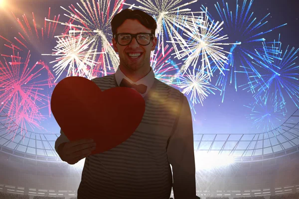 Geeky hipster holding heart card — Stock Photo, Image